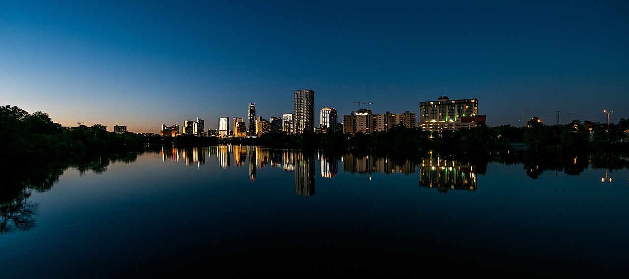 The Austin skyline at dusk, reflected in Lady Bird Lake.